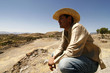 Handsome man with a hat, watching over the land, Mexico