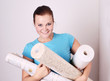 Photo: beautiful young woman with the wallpaper in the hands of beautiful young woman with the wallpaper in the hands of