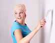 Photo: Female make repairs in the apartment Female make repairs in the apartment