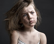 Messy Child against a Grey Background