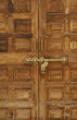Old wooden door with a massive brass lock, Indian handicraft