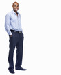 Foto: Happy young business man with hands in pockets on white Happy young business man with hands in pockets on white