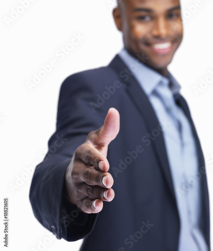 Foto: Business man offering handshake for deal on white Business man offering handshake for deal on white