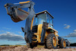 rear view of  Loader excavator with rised backhoe