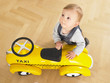 Baby with Toy Taxi