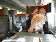 Mother Holding Baby on Train