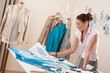 Professional tailor working with fashion sketches Professional tailor working with fashion sketches