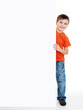 boy look outs from the blank banner