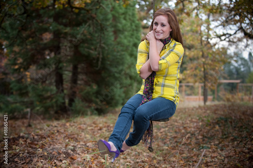 Photo: Pretty teen girl on a swing Pretty teen girl on a swing