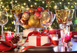 Holiday table setting with red ribbon gift Holiday table setting with red ribbon gift