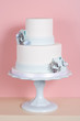 Two-tiered Cake Against Pink Background
