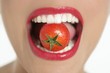 Eating a red tomato macro of woman mouth Eating a red tomato macro of woman mouth