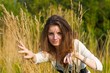 Pretty woman hiding in the grass