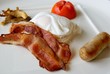 bacon poached egg sausage tomato and mushrooms for breakfast