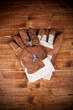 Two Glove And Screw Key on Vintage Wood Backgorund
