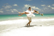 Wedding couple in Caribbean, by the sea.