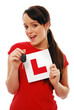 Foto: Excited girl holding car key and L plate Excited girl holding car key and L plate