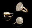 Two golden earrings and ring with diamonds