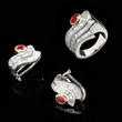 Two silver earrings and ruby ring