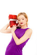 Young happy winter woman with red christmas present