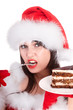 Christmas girl in  santa hat and cake on plate. Isolated.