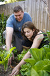 in the garden learning how to grow her own food.