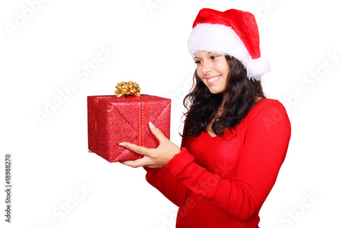 Santa girl looking at christmas gift Santa girl looking at christmas gift