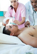 Nurse putting oxygen mask on a patient