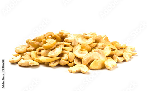 Photo: handful of cashew nuts isolated on white handful of cashew nuts isolated on white
