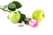 Rose, kiss and green apples on white background