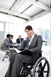 Portrait of a smiling businesswoman in a wheechair Portrait of a smiling businesswoman in a wheechair