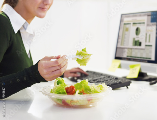 Photo: businesswoman eating salad businesswoman eating salad