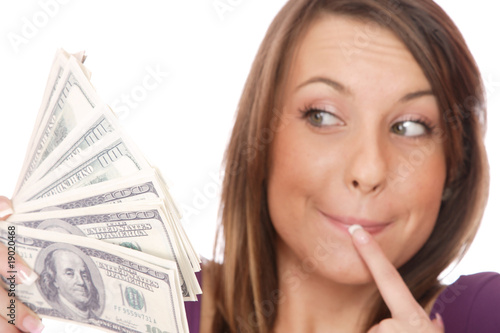 Photo: Attractive woman takes lot of 100 dollar bills Attractive woman takes lot of 100 dollar bills