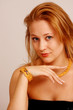 Elegant woman wearing gold jewelery
