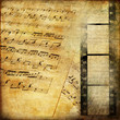 Photo: vintage background with musical pages and filmstrip vintage background with musical pages and filmstrip