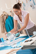 Female fashion designer working at studio