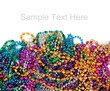 Mardi gras beads on white with copy space