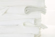 Foto: Heimtextilien,Stapel Handtuecher auf weiss Heimtextilien,Stapel Handtuecher auf weiss