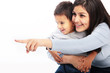 Photo: Mother showing toddler something Mother showing toddler something