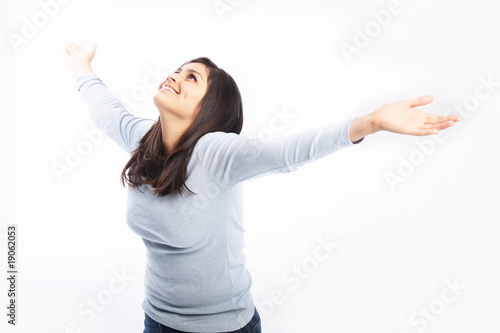 Photo: Carefree person raising hands up Carefree person raising hands up