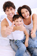 Happy family showing thumbs-up gesture