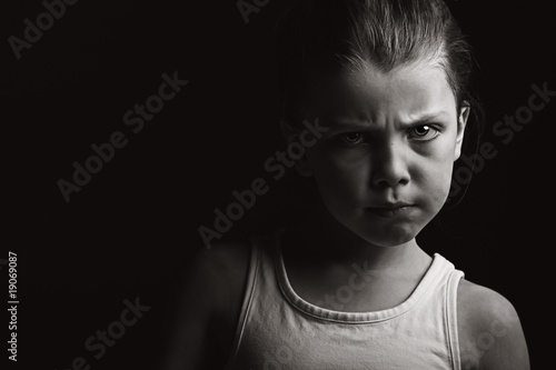 Photo: Low Key Shot of a Child with Attitude Low Key Shot of a Child with Attitude