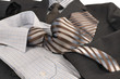Man's jacket, shirt, tie.
