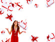 Excited attractive woman with many gift boxes and bags..