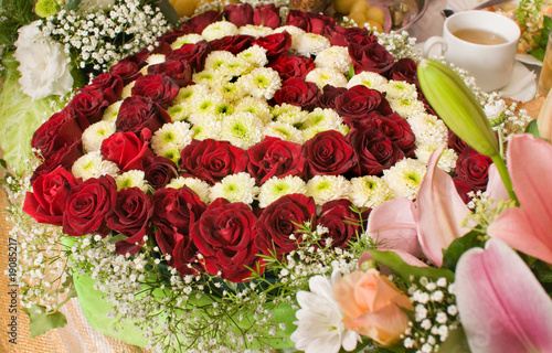 Photo: Flowers and celebratory table. Flowers and celebratory table.