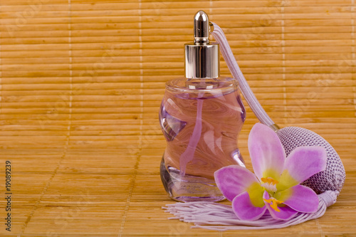 Flower and glass perfume bottle