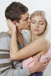 Man kissing woman in a cheek