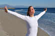 Thankful woman facing the sun Thankful woman facing the sun