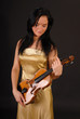 Young beautiful woman paying the violin