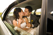 Newlyweds kissing in limo Newlyweds kissing in limo